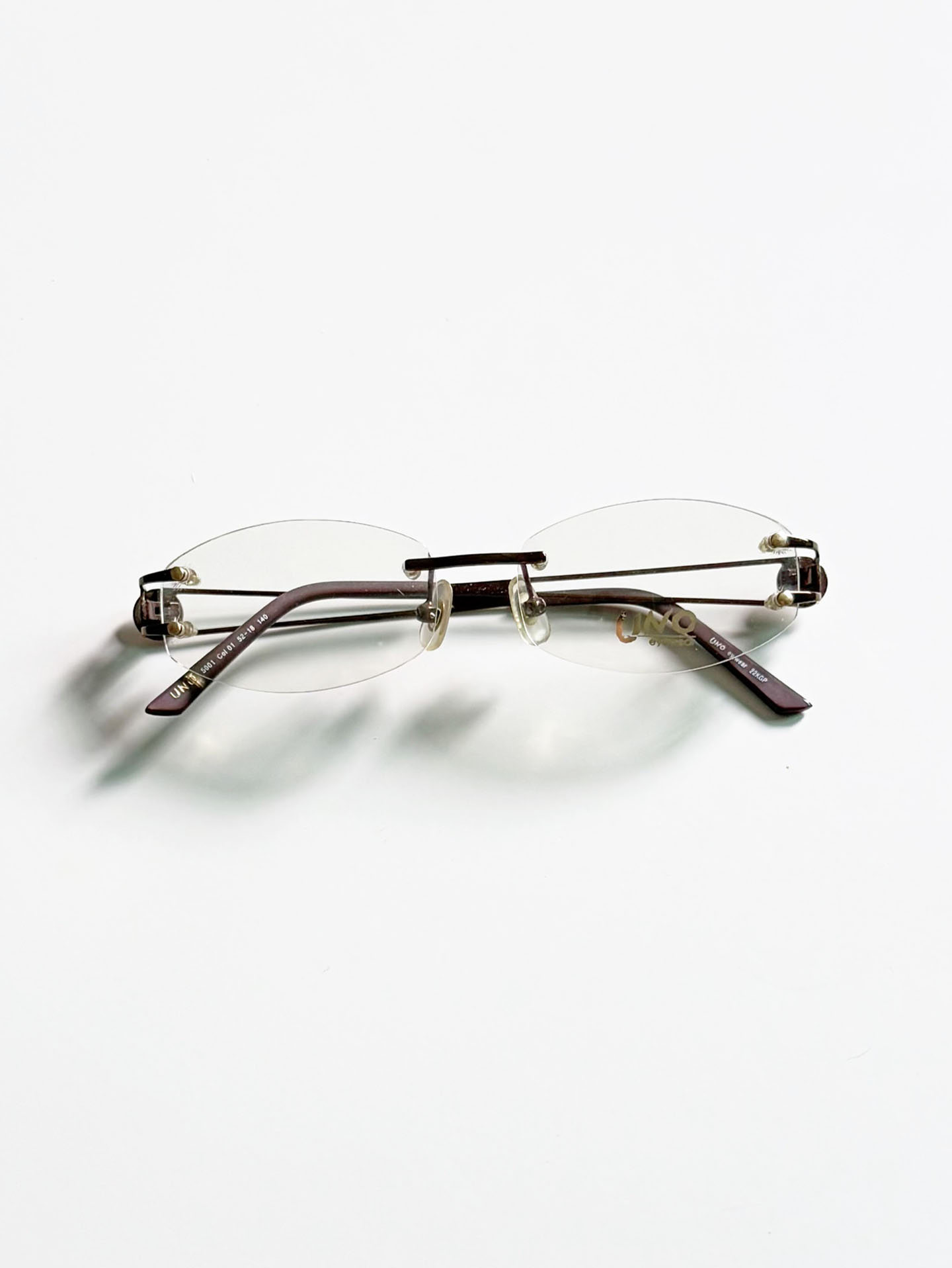 UNO Brown Rimless Oval Metal Glasses