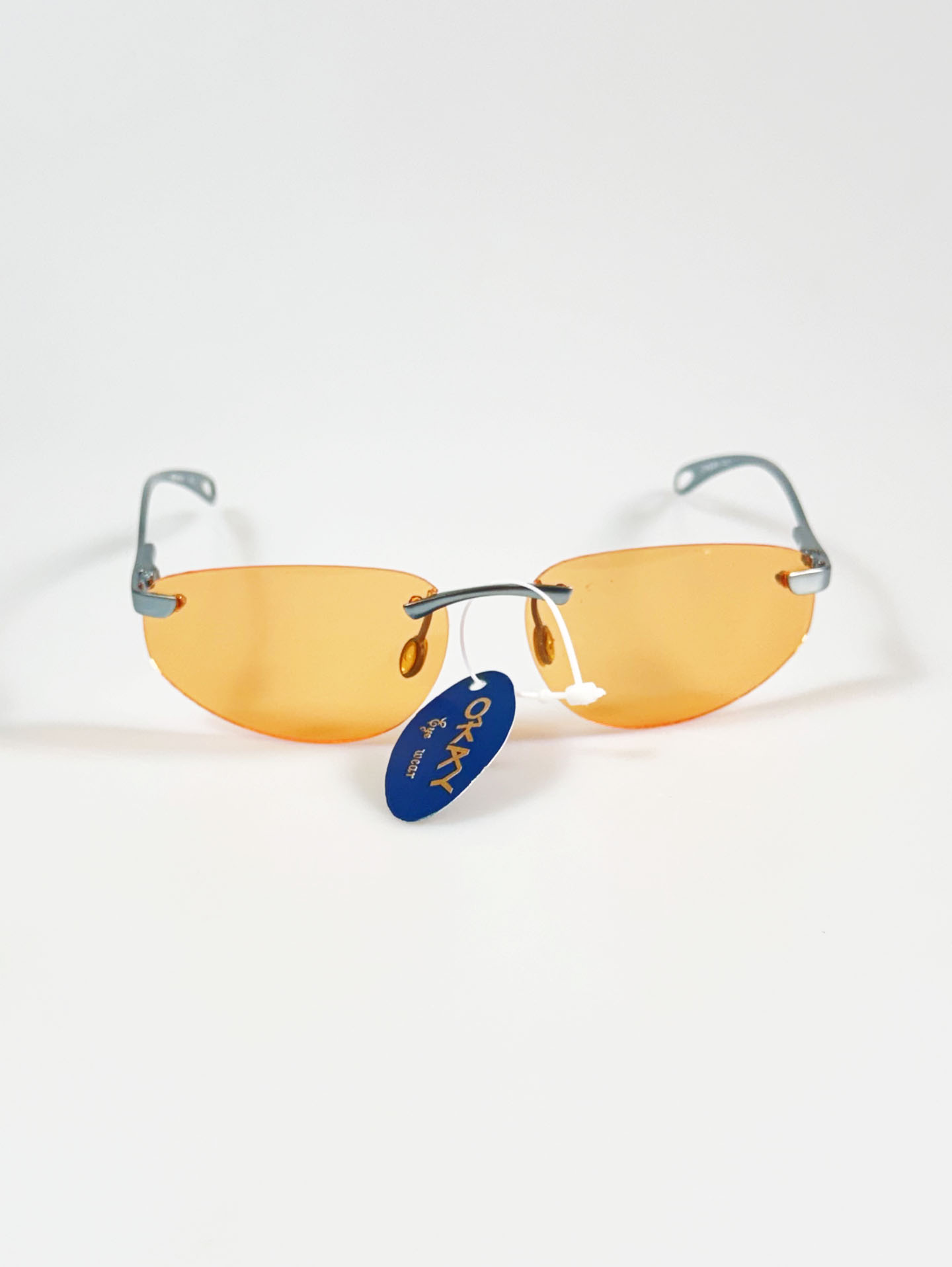 90's OKAY EYEWEAR Orange Tint Oval Rimless Metal Sunglasses