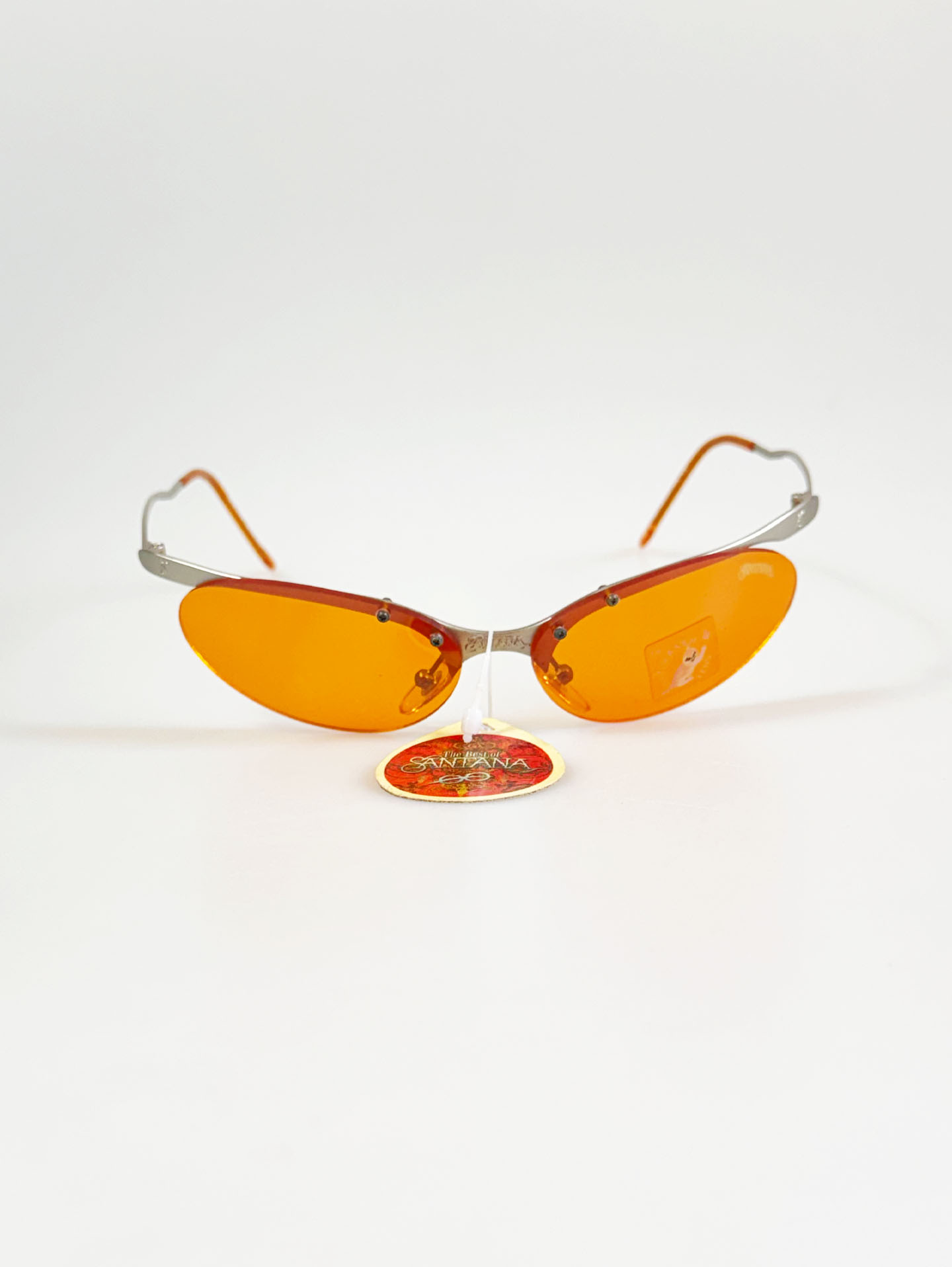 90's SANTANA Silver Rimless Oval Metal Orange Tint Sunglasses