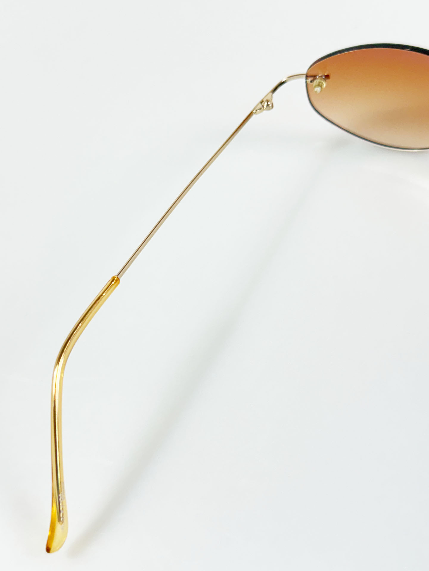 CAPRIO Rimless Oval Gold Metal Tinted Sunglasses