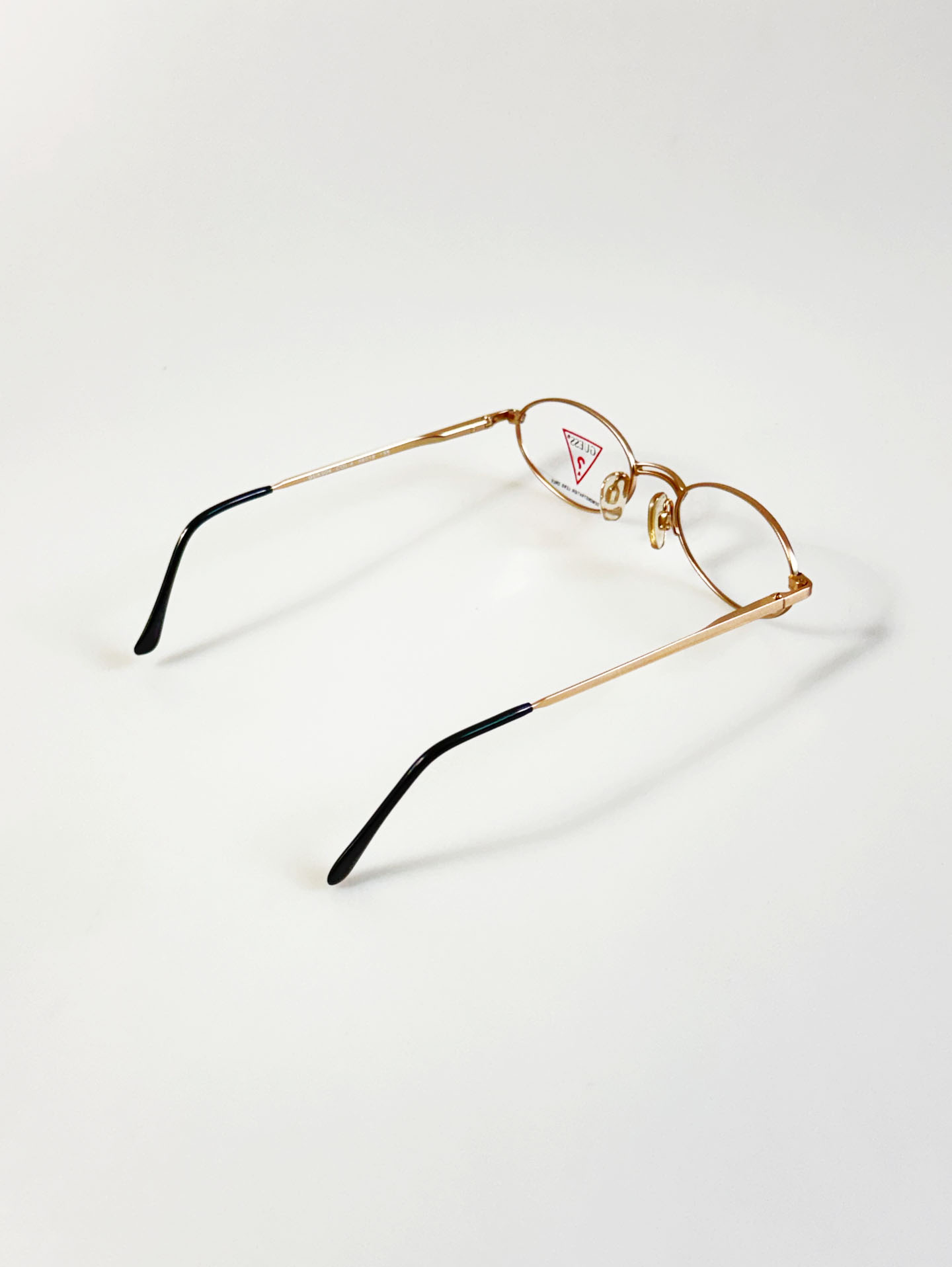 GUESS Matte Gold Slim Oval Metal Glasses