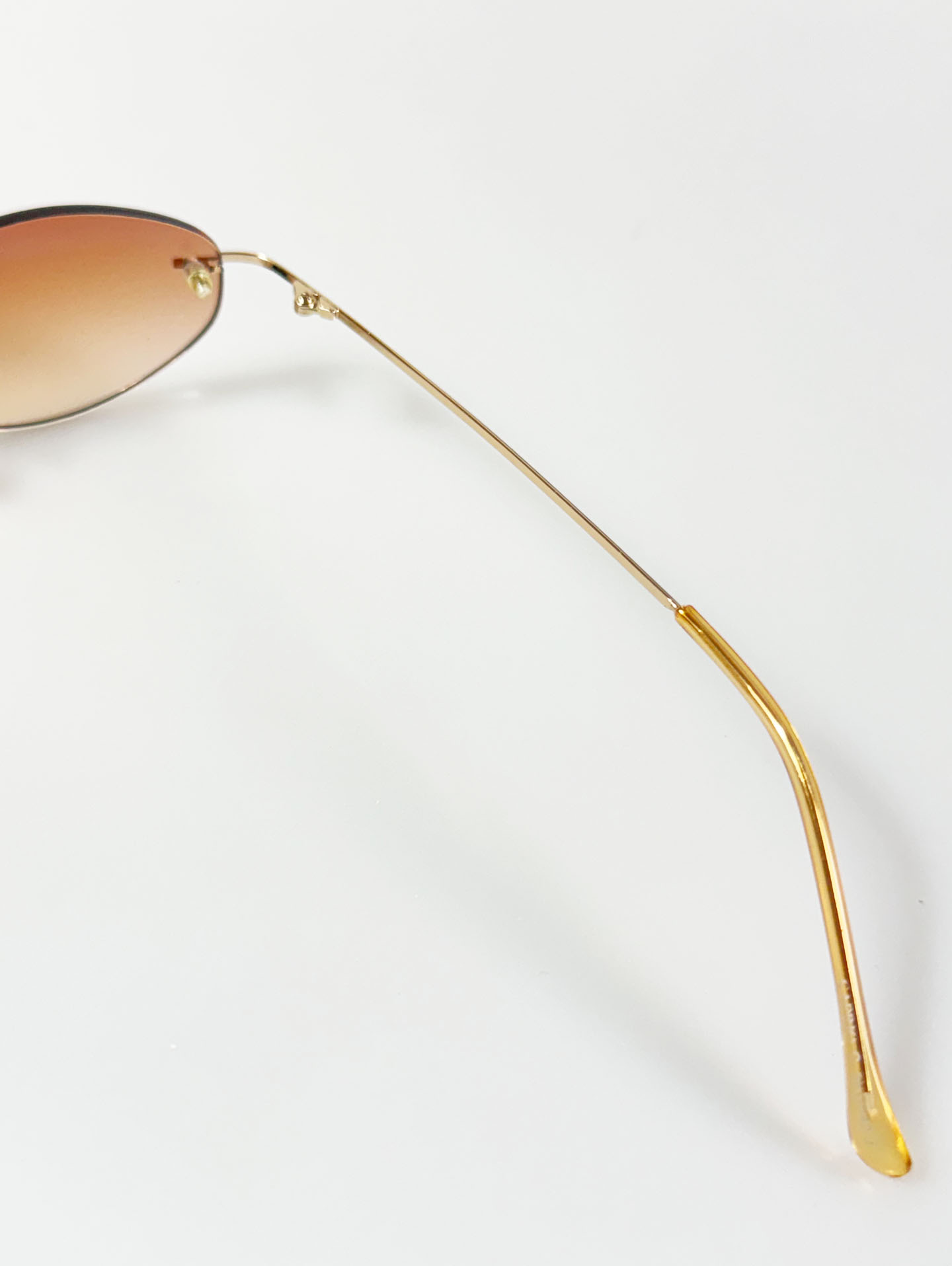 CAPRIO Rimless Oval Gold Metal Tinted Sunglasses
