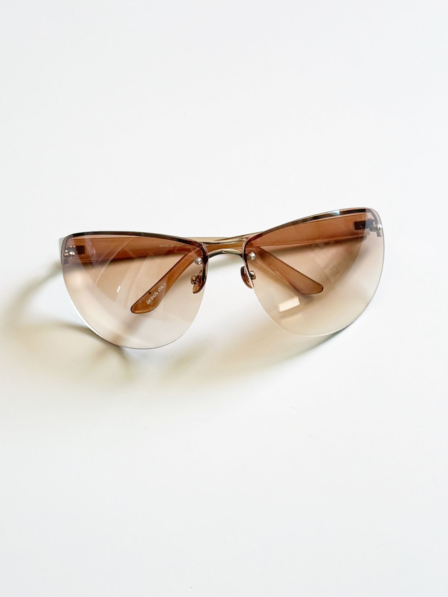 Wraparound Shield Rimless Metal Frame Tinted Sunglasses