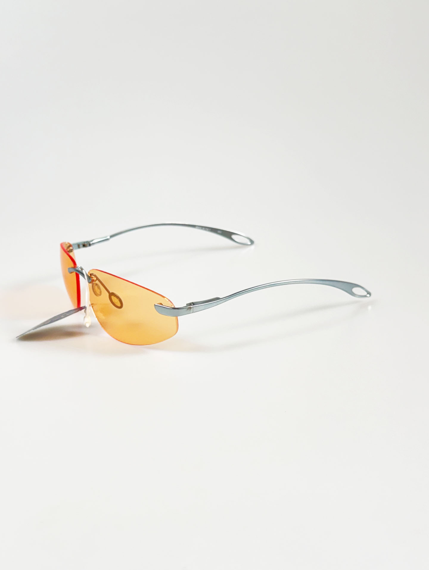 90's OKAY EYEWEAR Orange Tint Oval Rimless Metal Sunglasses