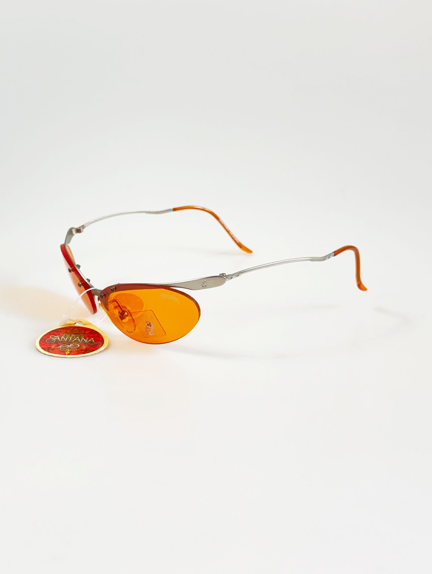 90's SANTANA Silver Rimless Oval Metal Orange Tint Sunglasses