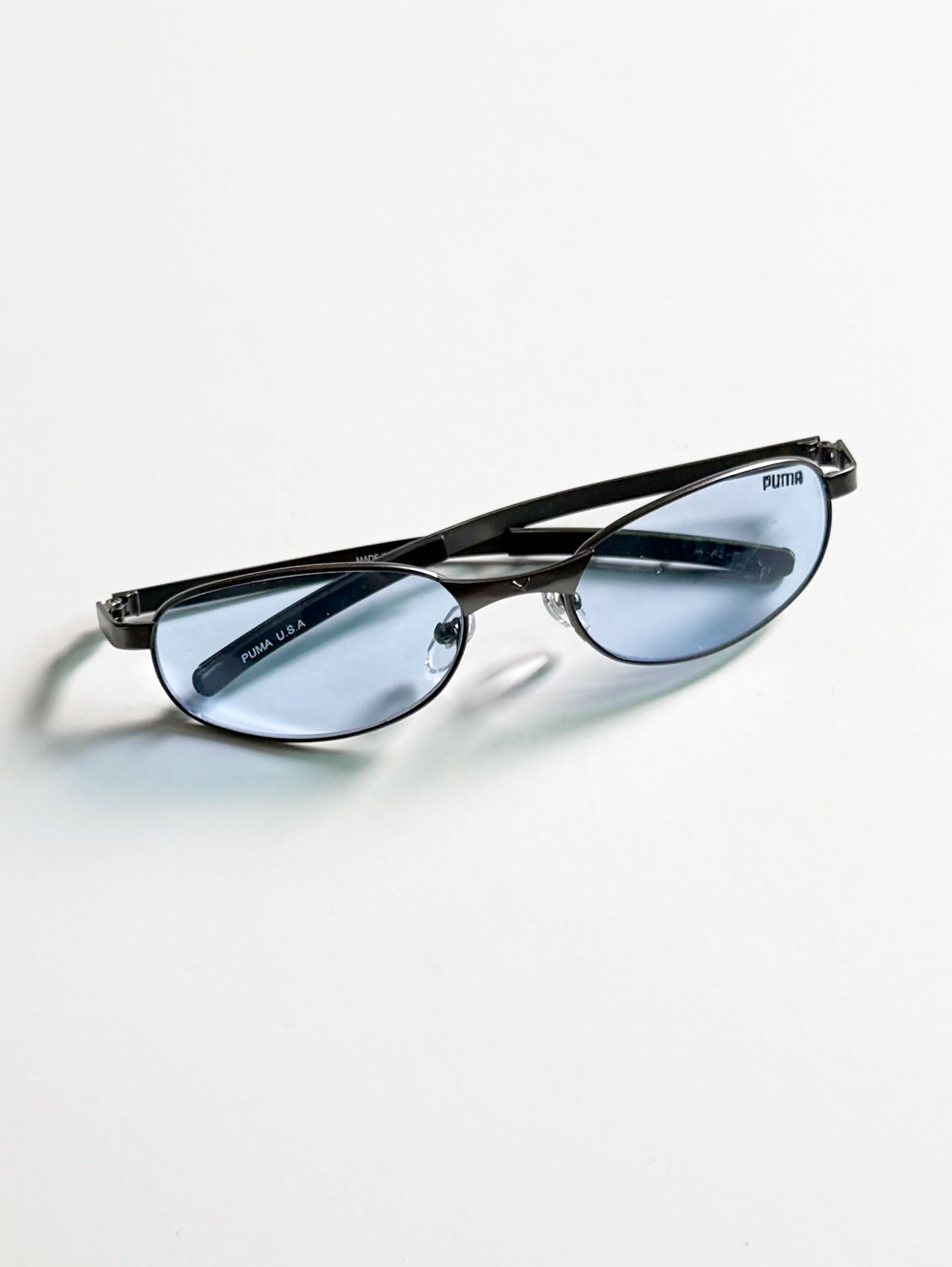 90's PUMA Dark Gunmetal Slim Oval Tint Sunglasses