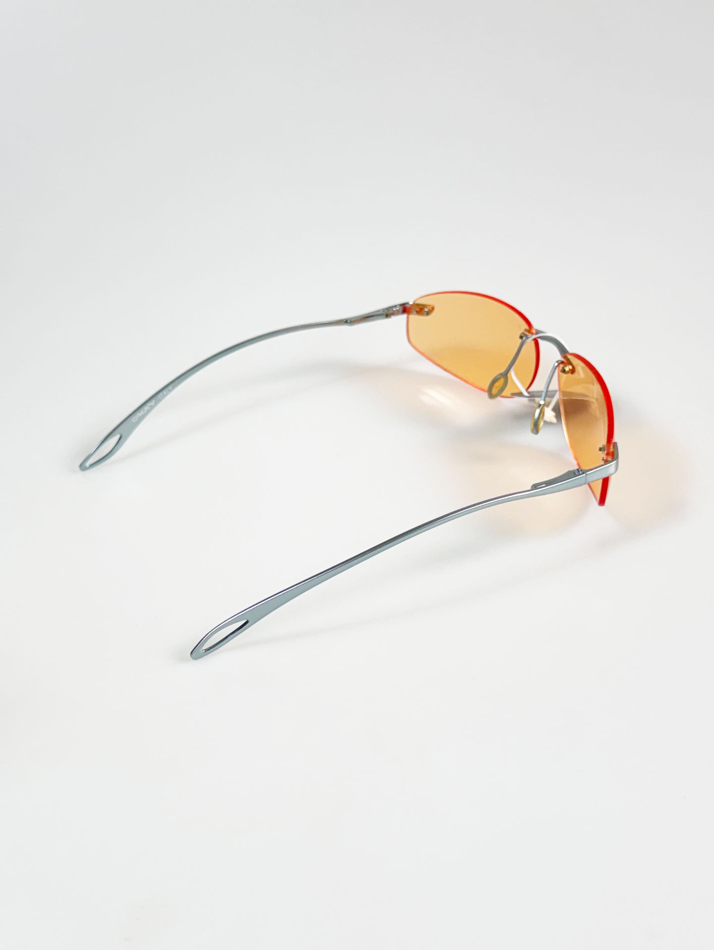 90's OKAY EYEWEAR Orange Tint Oval Rimless Metal Sunglasses