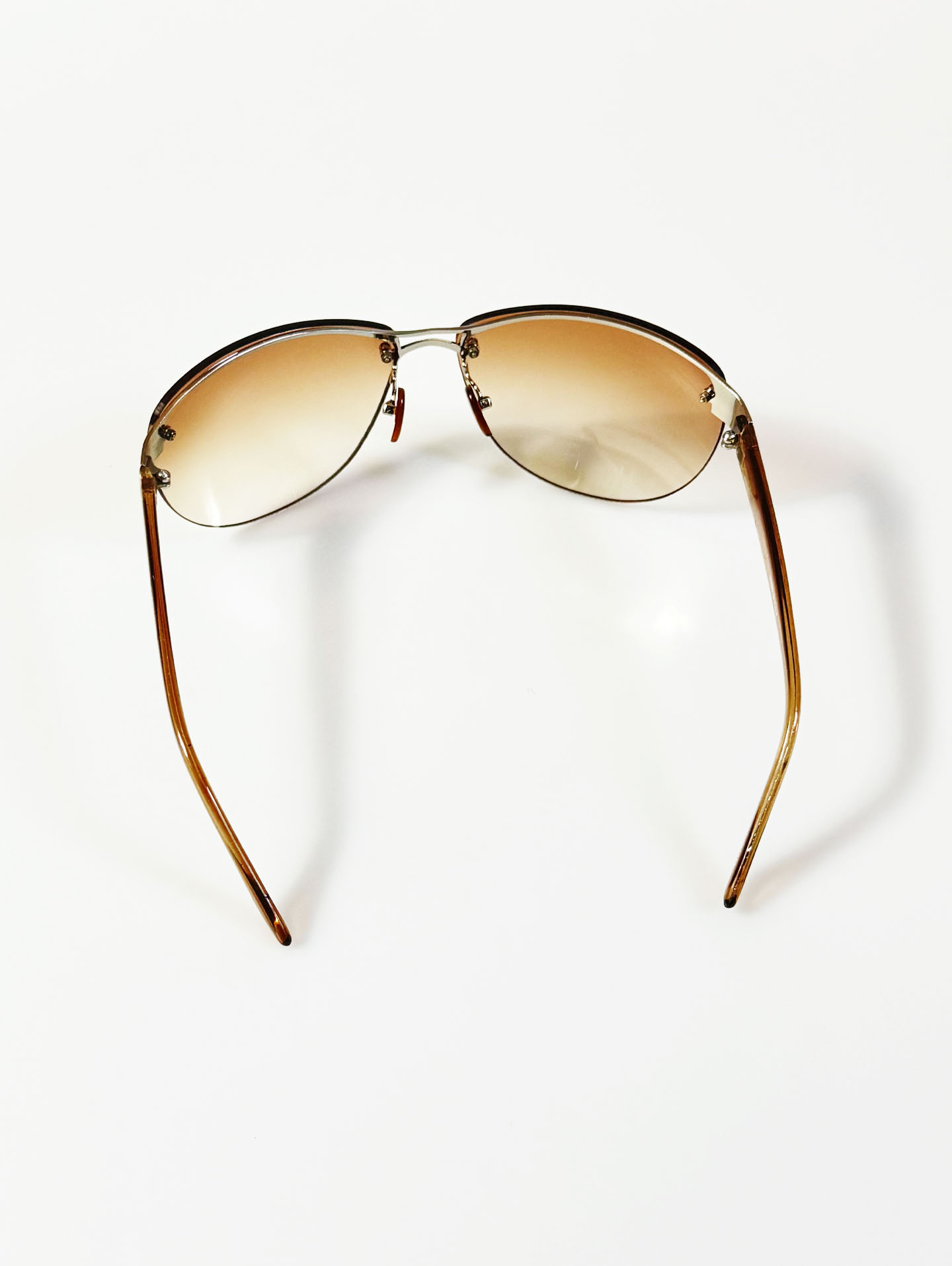 Wraparound Shield Rimless Metal Frame Tinted Sunglasses