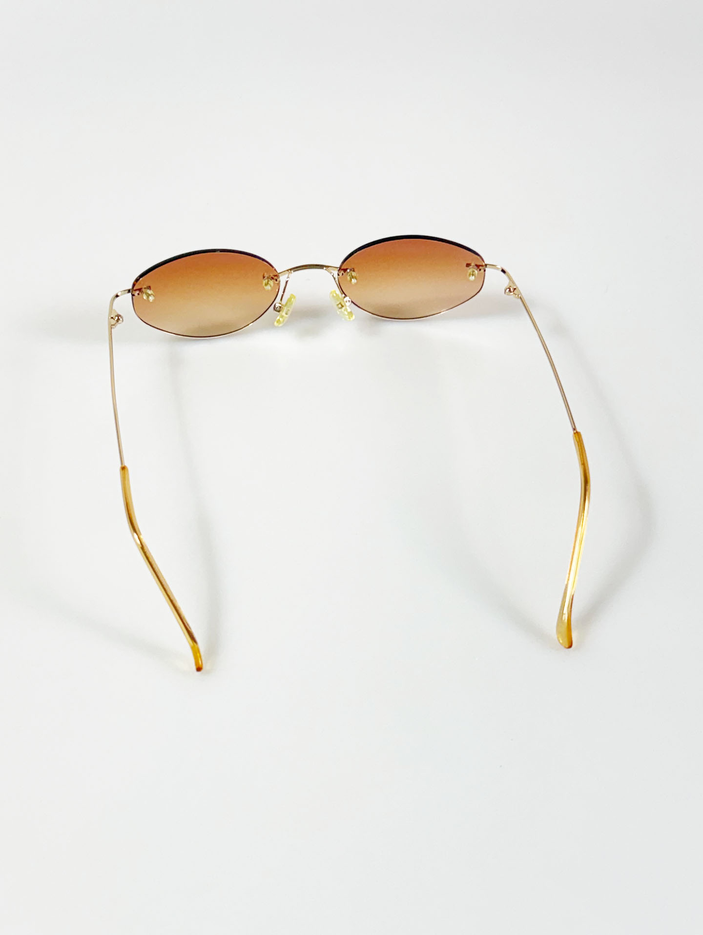 CAPRIO Rimless Oval Gold Metal Tinted Sunglasses