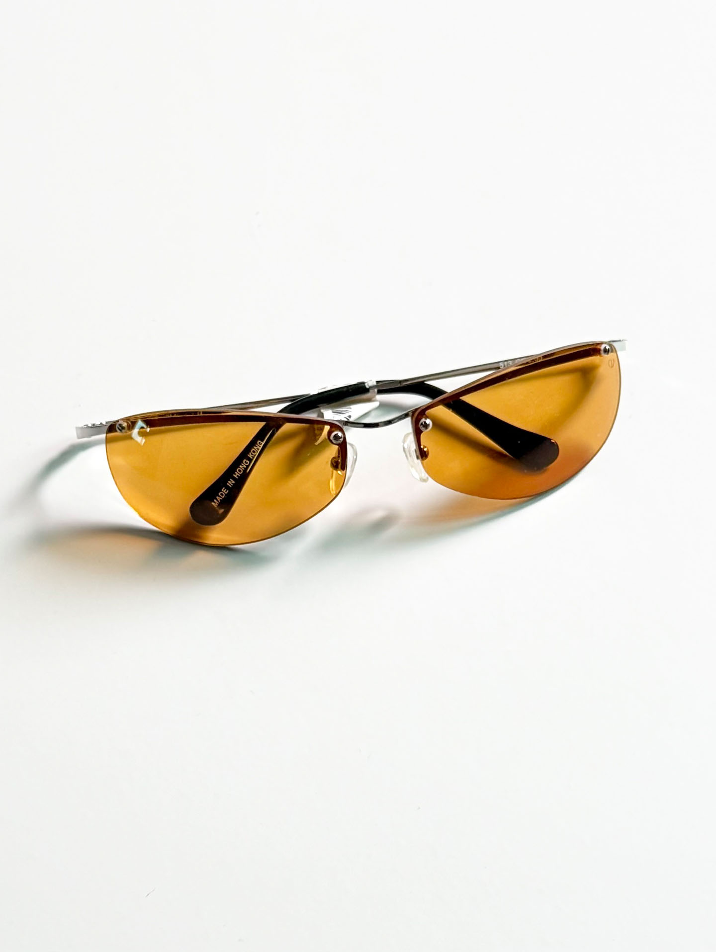SILVIO VALENCIA Silver Rimless Oval Metal Orange Tint Sunglasses