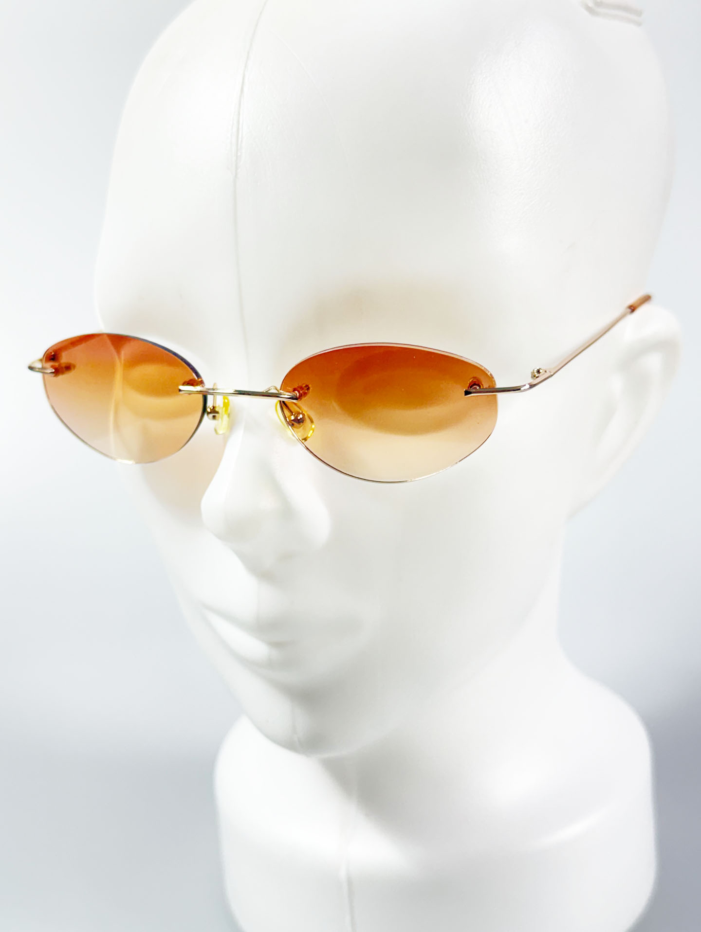 CAPRIO Rimless Oval Gold Metal Tinted Sunglasses