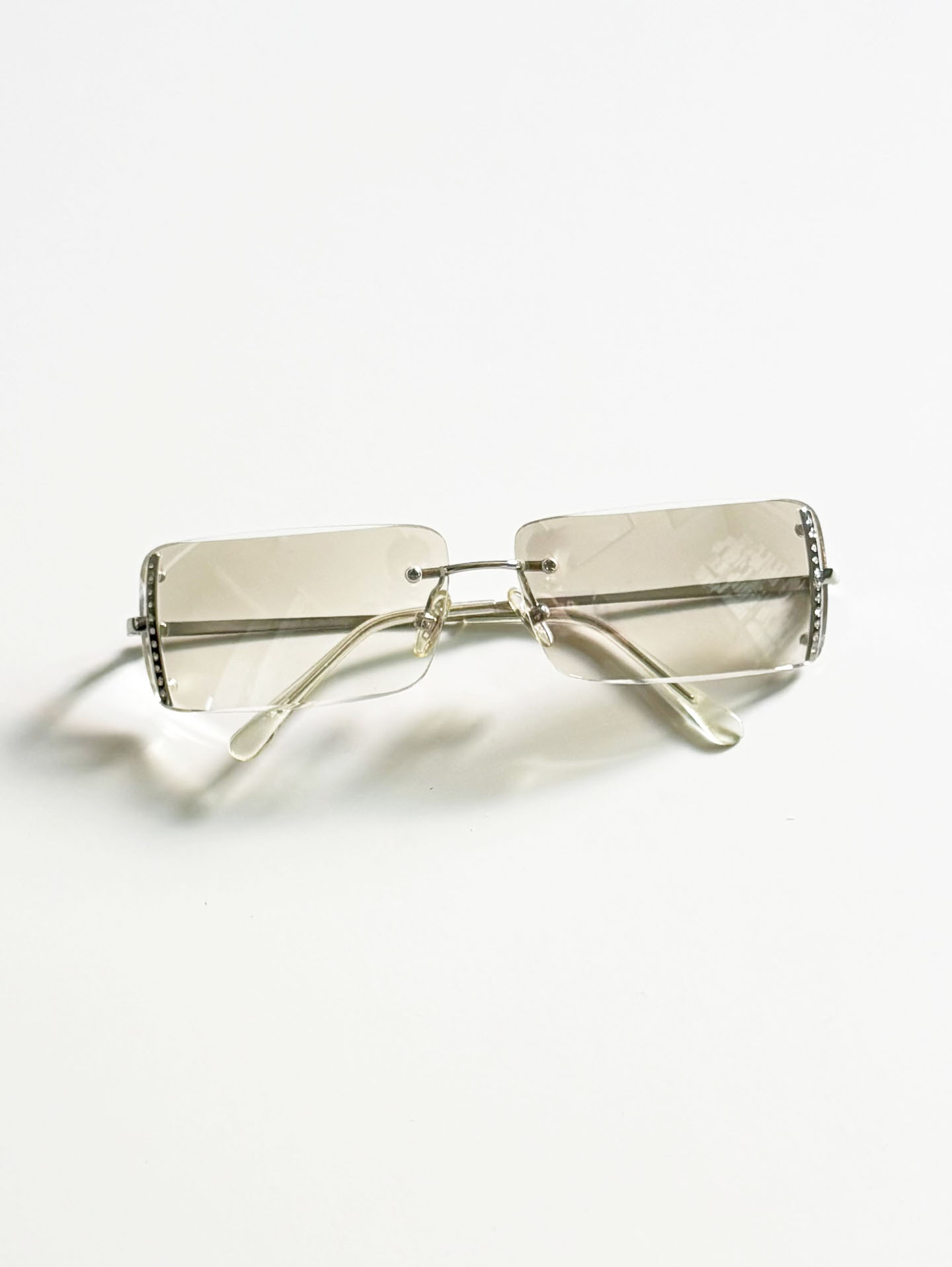 CAPRIO Silver Rimless Square Metal Clear Tinted Sunglasses