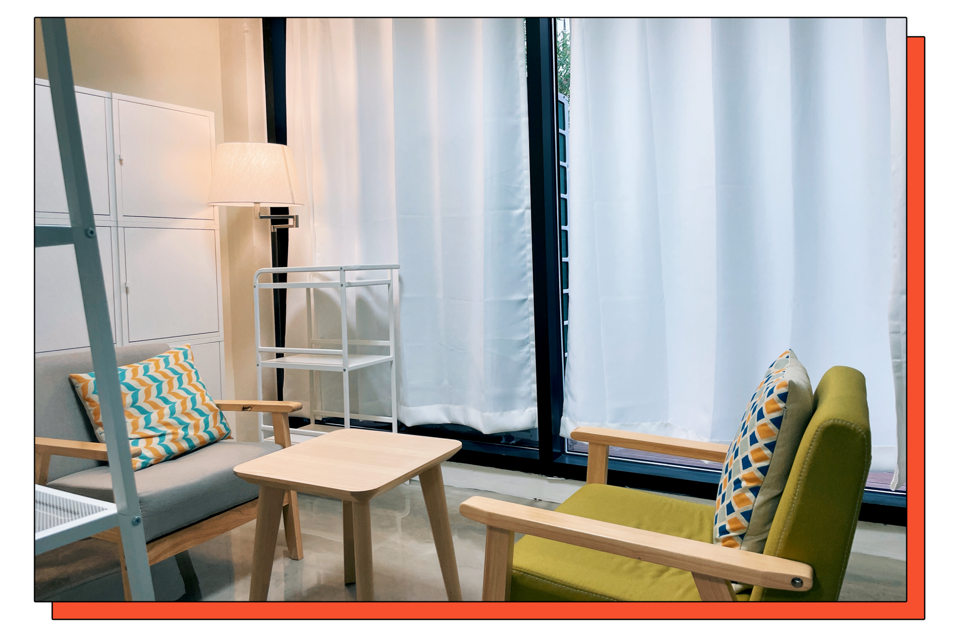 A cozy counseling room with two sofas facing each other under warm lighting.