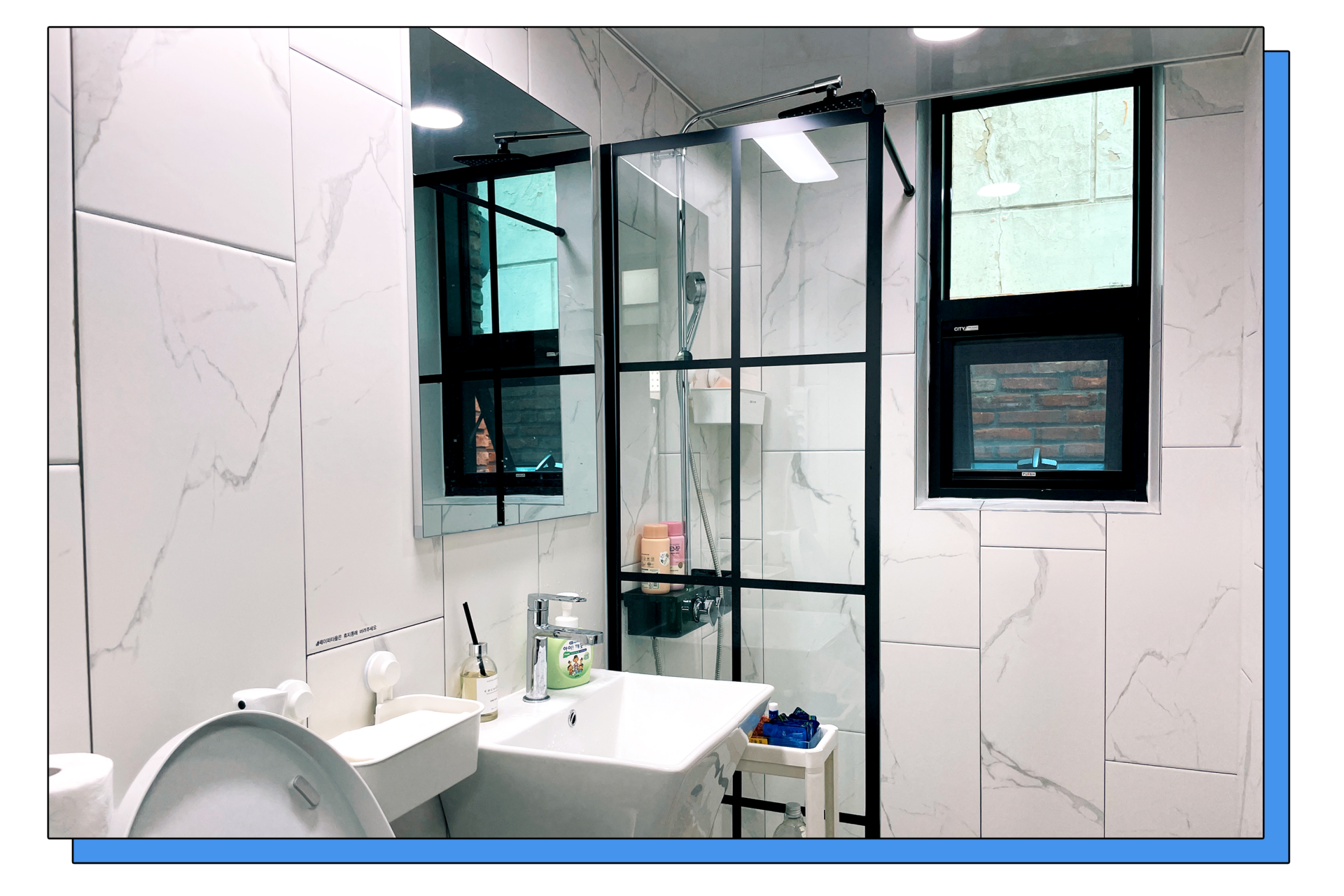 A private restroom with a shower booth.