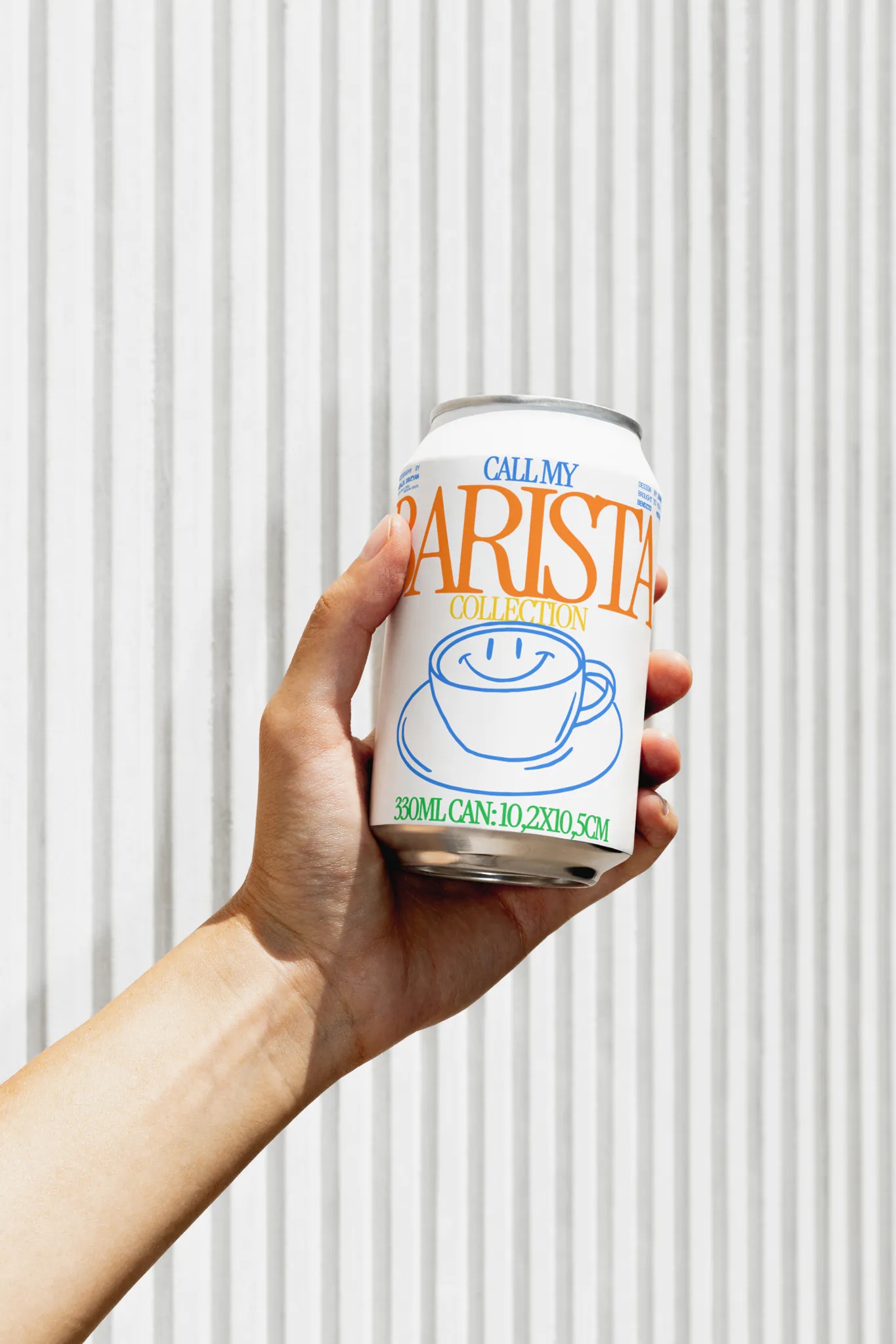 soda can mockup held by one hand