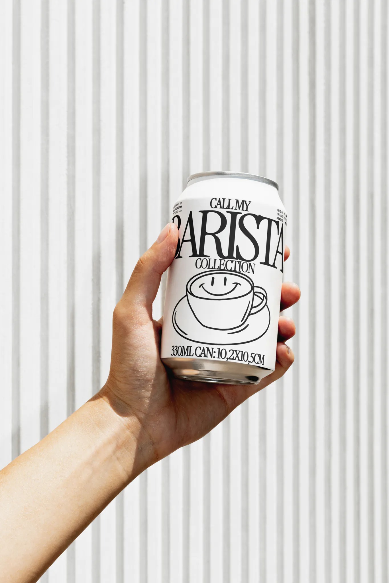 soda can mockup held by one hand