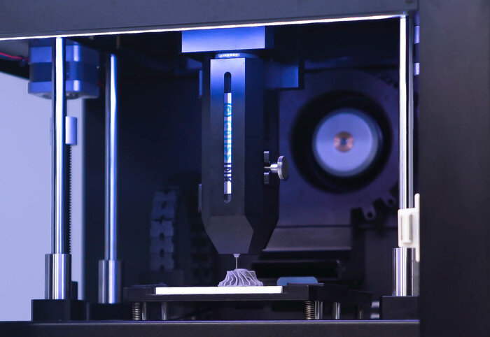 GAUSS MT90 3D printing a metal paste part using PME technology. Photo via MetalPrinting.
