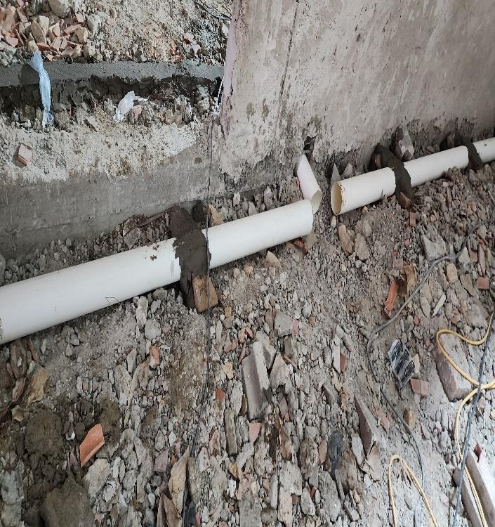 A white pipe on the ground  AI-generated content may be incorrect.