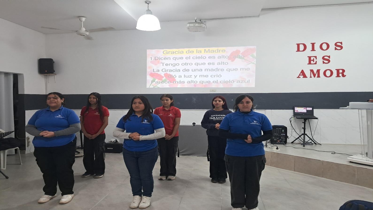 A group of women standing in a room  AI-generated content may be incorrect.