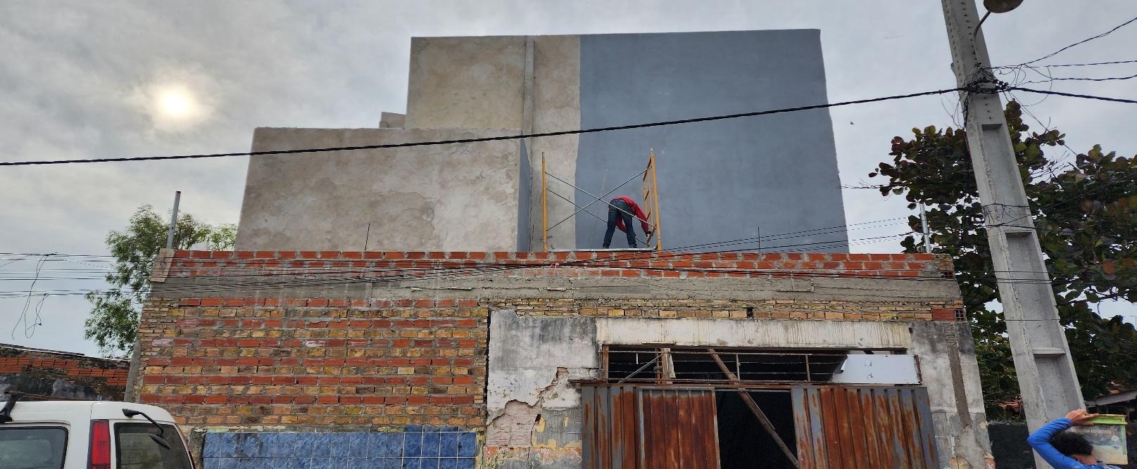 A person on the roof of a building  AI-generated content may be incorrect.