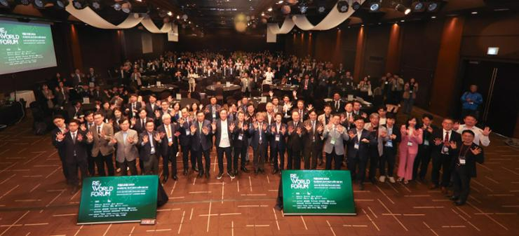 Participants pose for a group photo during ReWorld Forum 2024 at HW Convention Center in Seoul, Wednesday. Courtesy of SDX Foundation