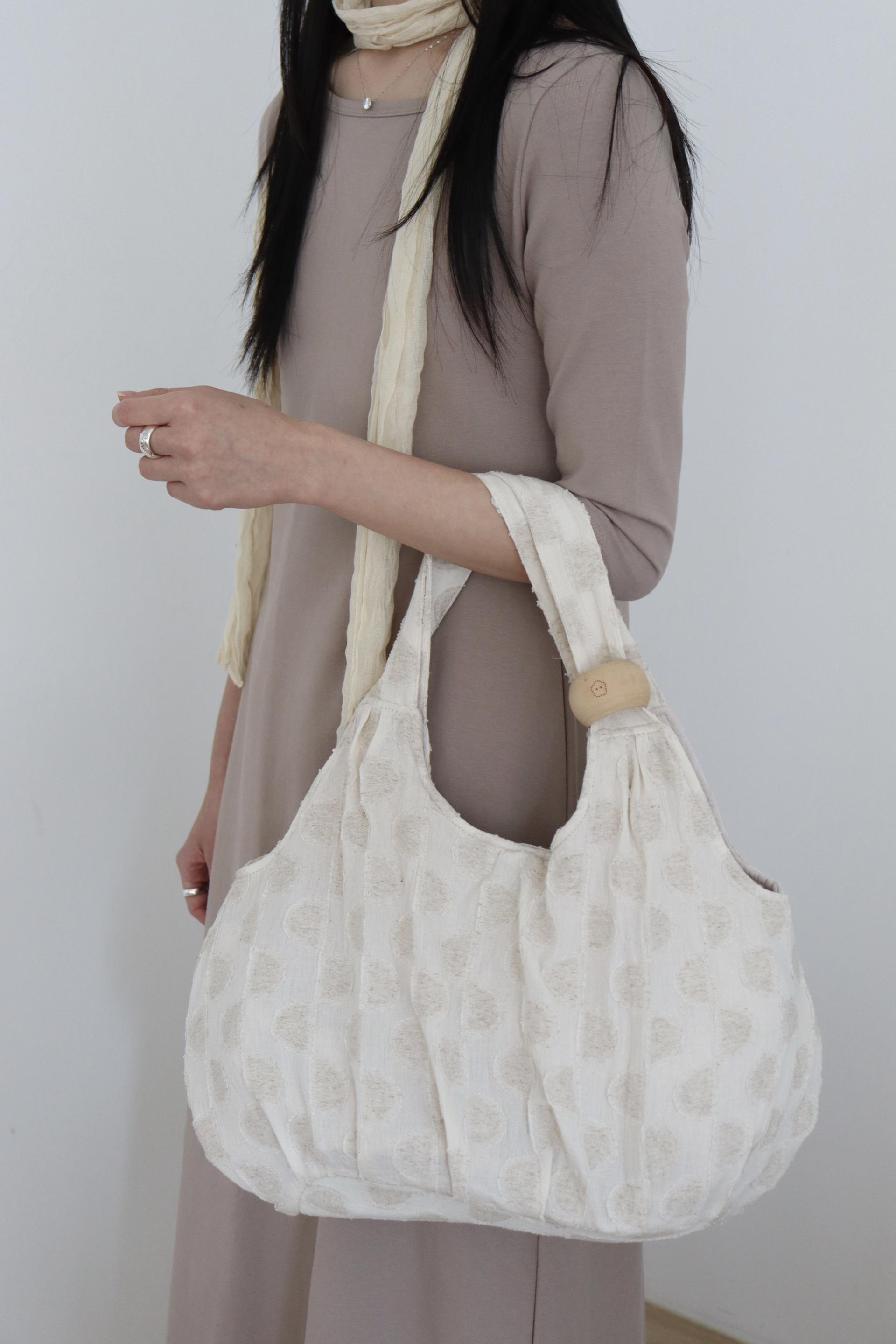plum linen puff bag