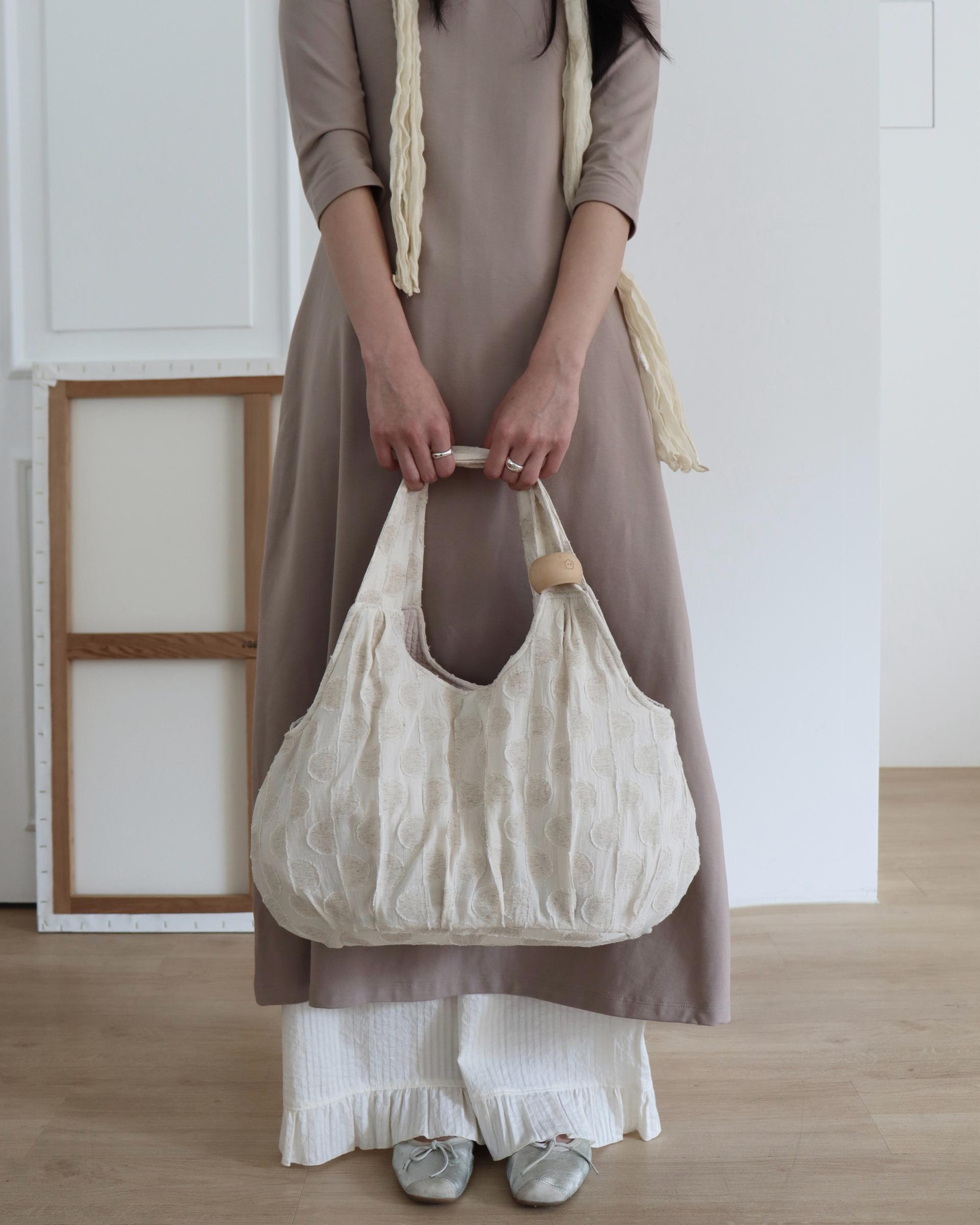 plum linen puff bag