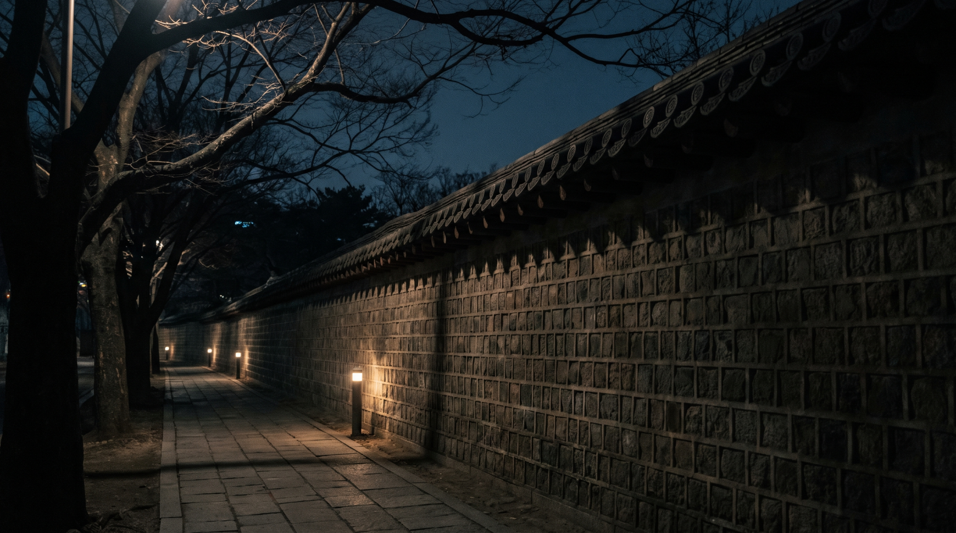 Deoksugung palace wall at night in Seoul, where an evening itinerary begins