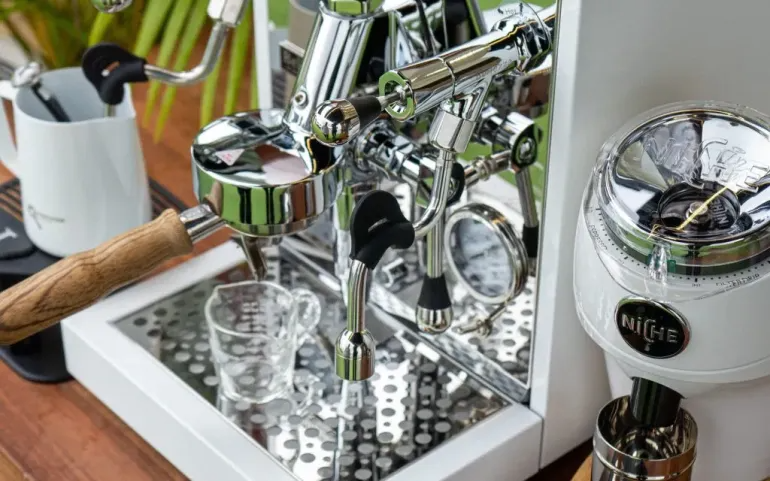 A chrome espresso machine in a person's home.